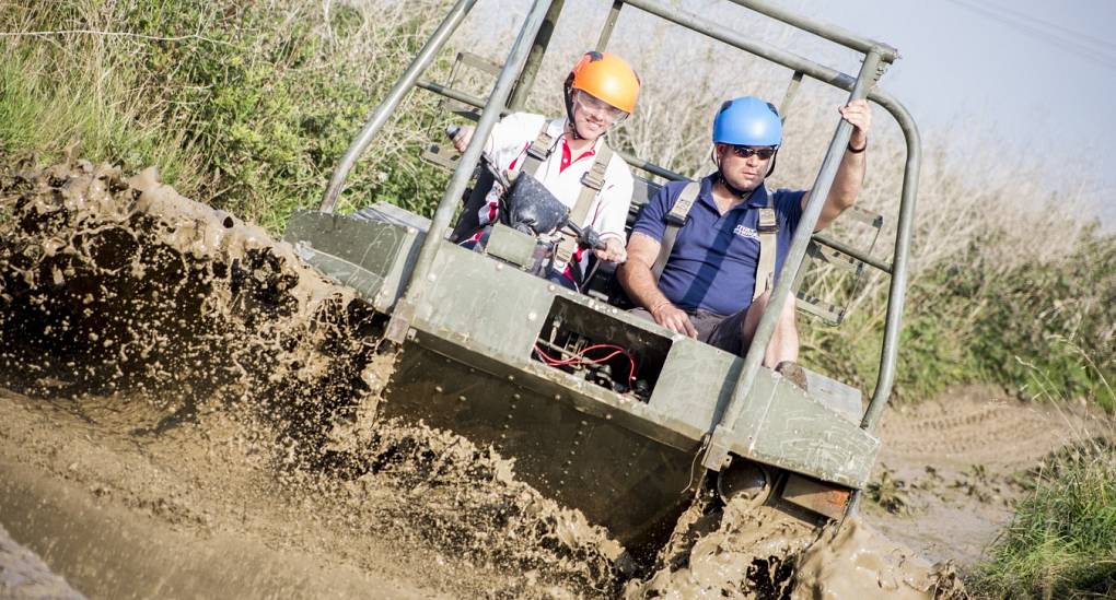 hen party and instructor tackle a water obstacle 