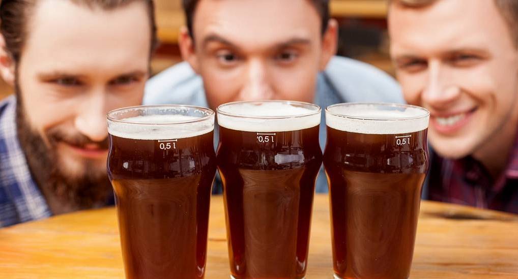 Group of friends look at beer