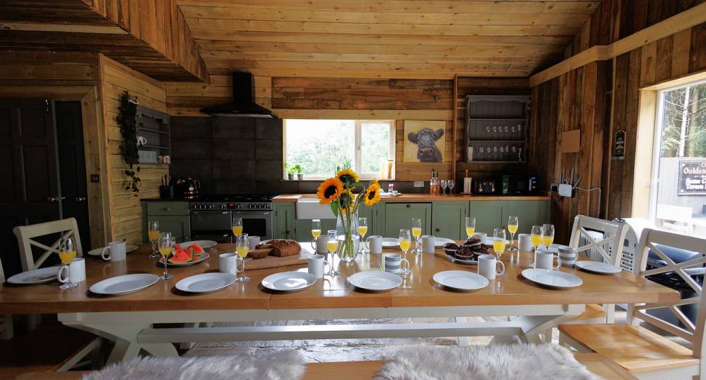Open plan dining table and kitchen