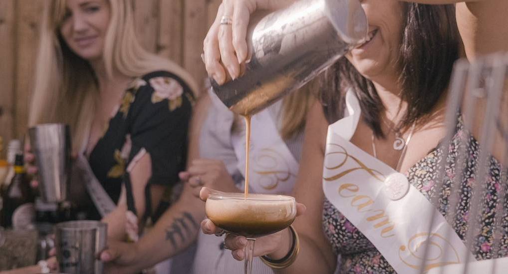 Group of hens enjoy cocktail making