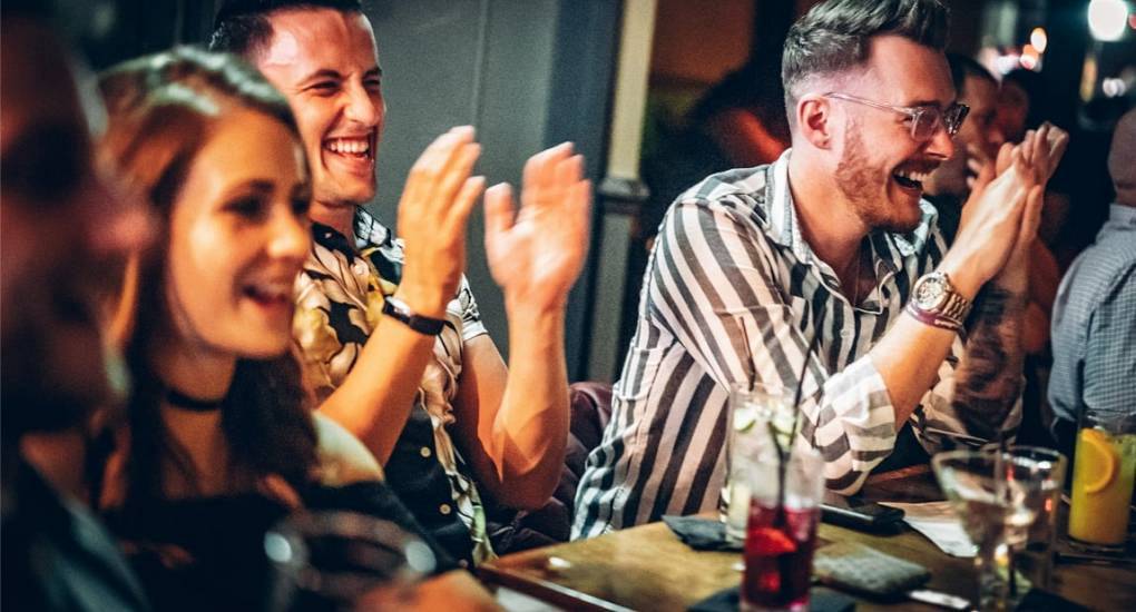 people enjoying a comedy club