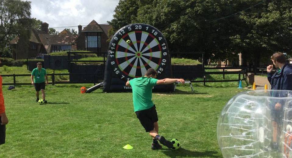 Man playing footdarts pulls a rabona