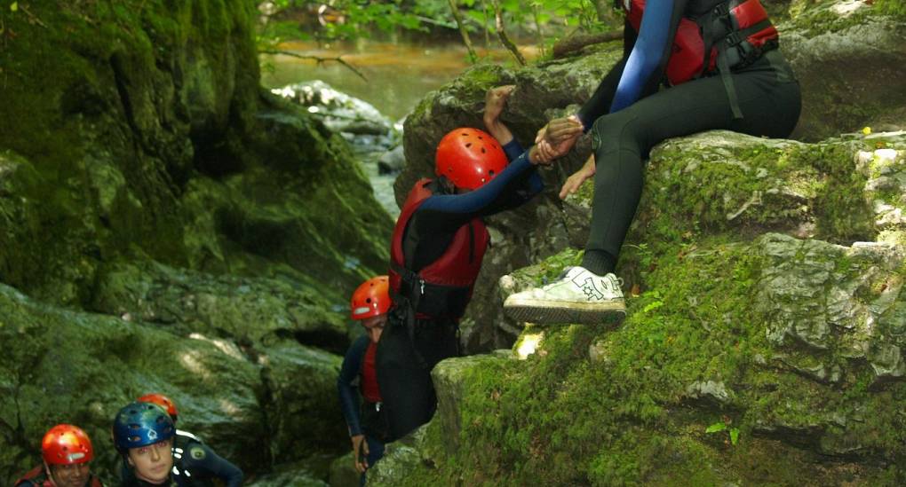 Traversing the rugged riverside whilst Gorge Scrambling