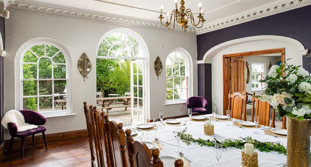 Grand Manor Luxury Party House dining room with large window