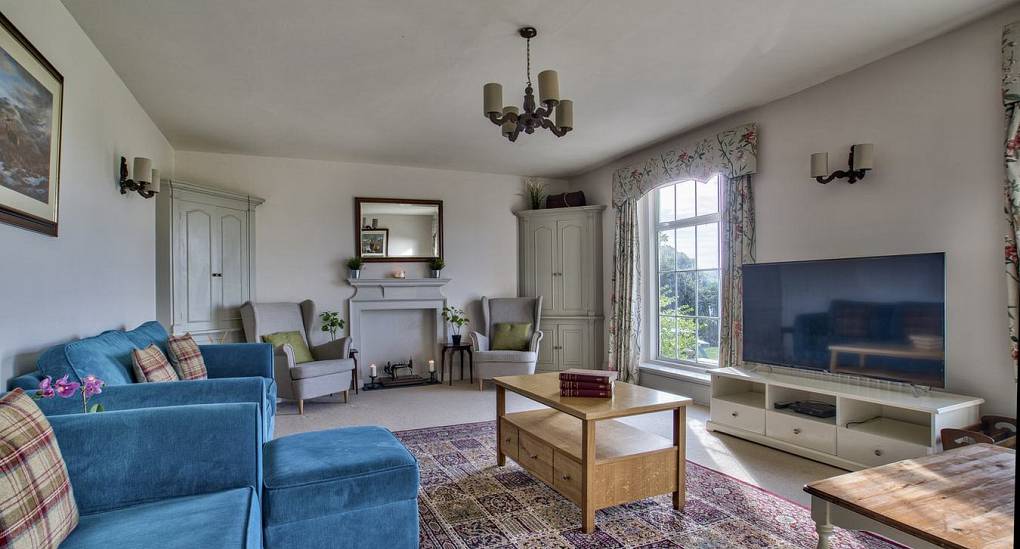 TV room with plenty of sofas