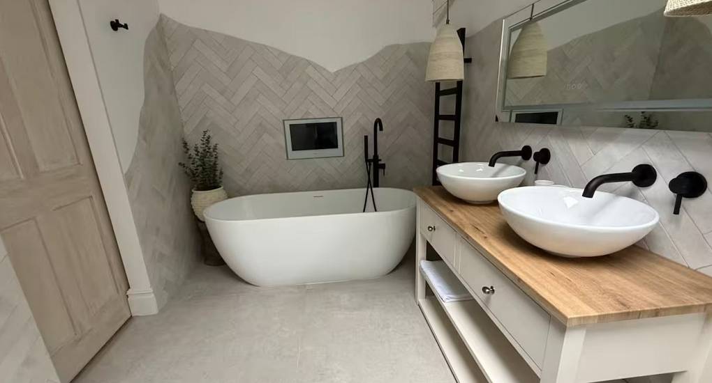House of Dreams nr Chester spacious modern bathroom with double vanity and large shower for luxury hen party accommodation.