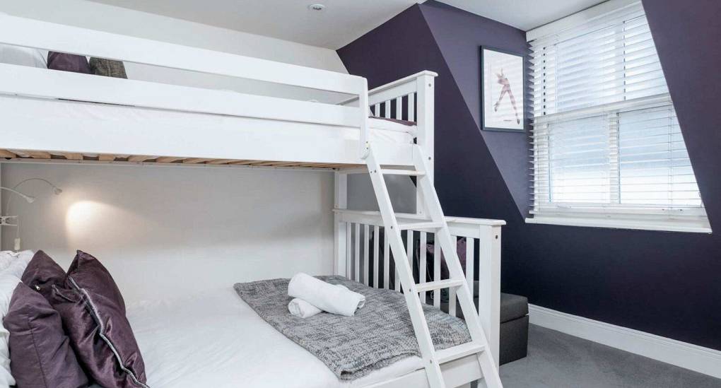 Bunk beds with towels on the bed