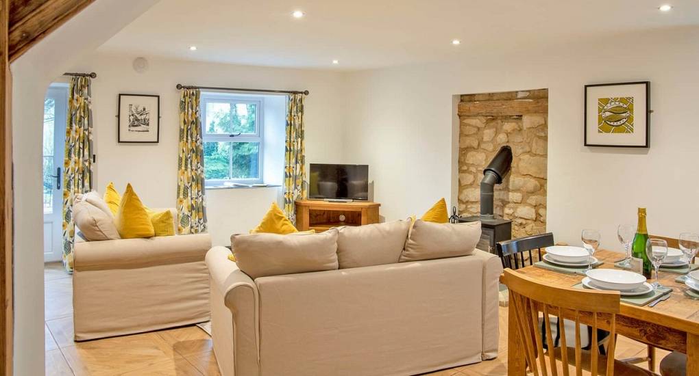 Spacious open-plan lounge and dining area for socialising during a Peak District hen weekend at Lathkill.