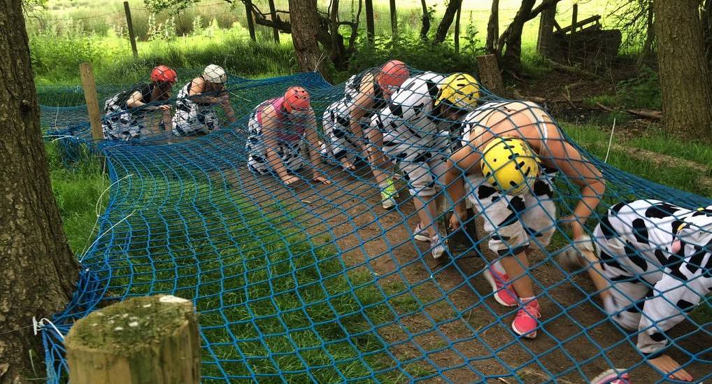 Hen do in fancy dress make their way under the cargo net