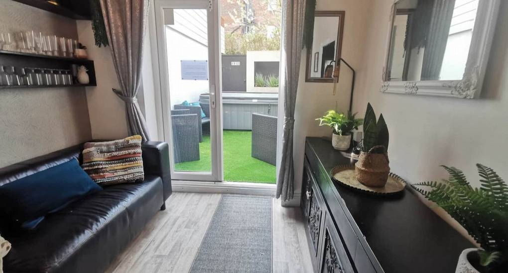 View from the lounge out to the private hot tub garden at the Bournemouth Hot Tub Garden hen party house.