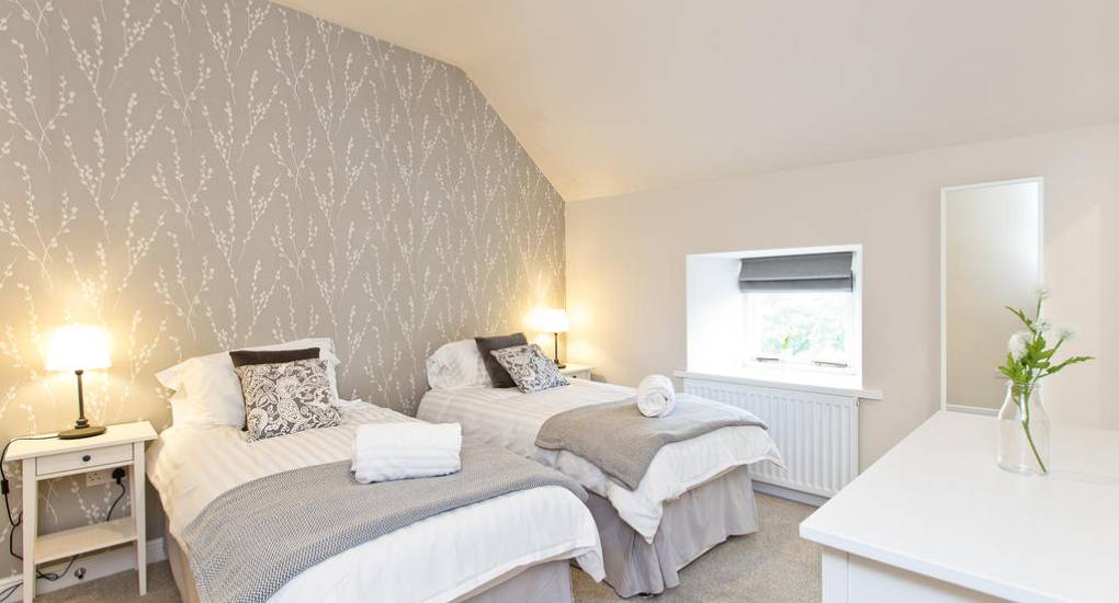 Bedroom three at Peak Star: A charming guest room in a traditional Derbyshire stone cottage for Peak District hen weekends.