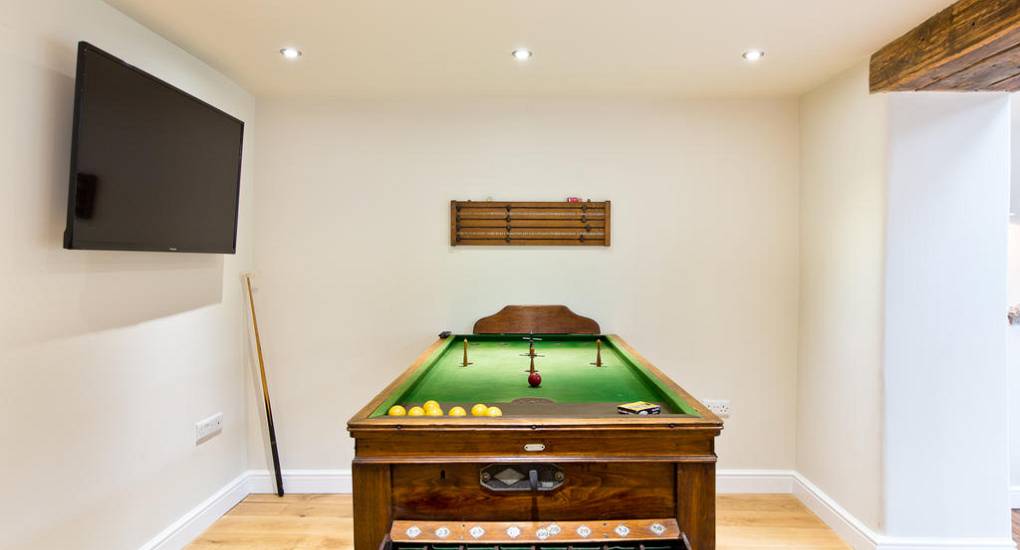 Private games room at Peak Star featuring a full-size billiards table for competitive Peak District hen party weekends.