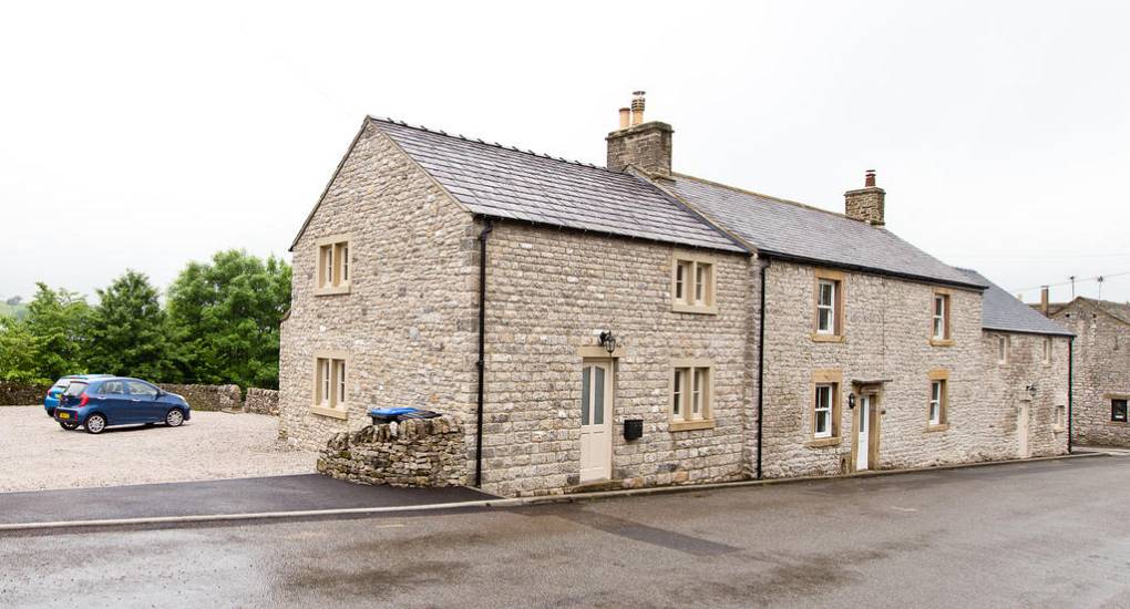 Exterior view of Peak Star: A large traditional Derbyshire stone property sleeping up to 18 guests for a Peak District hen do.
